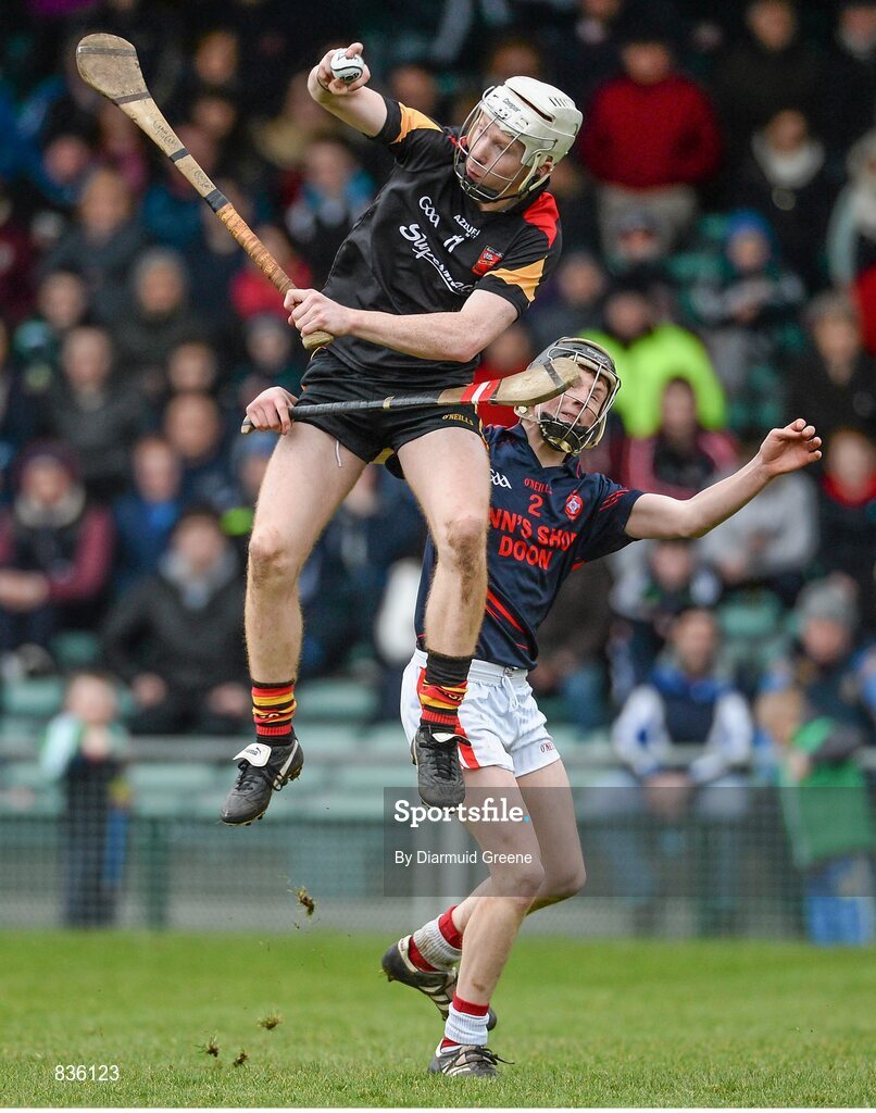 22 February 2014; Cian Lynch, Ard Scoil Ris, in action against Brian McPartland, Scoil na Trionoide Naofa. Dr. Harty Cup Final, Scoil na Trionoide Naofa, Doon v Ard Scoil Ris, Limerick. Gaelic Grounds, Limerick. Picture credit: Diarmuid Greene / SPORTSFILE