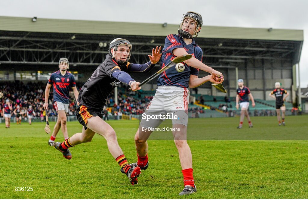 22 February 2014; Barry Murphy, Scoil na Trionoide Naofa, is blocked down by Josh O'Halloran, Ard Scoil Ris. Dr. Harty Cup Final, Scoil na Trionoide Naofa, Doon v Ard Scoil Ris, Limerick. Gaelic Grounds, Limerick. Picture credit: Diarmuid Greene / SPORTSFILE