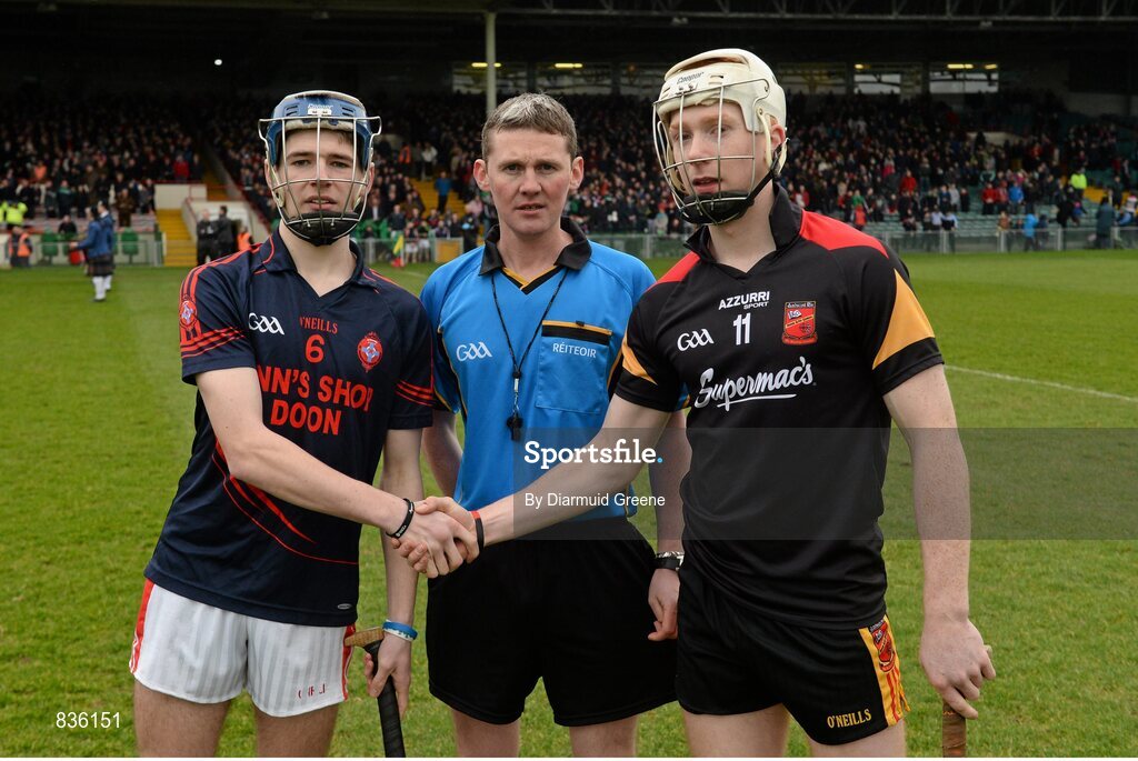 22 February 2014; Scoil na Trionoide Naofa captain Stephen Ryan, left, and Ard Scoil Ris captain Cian Lynch exchange a handshake in the company of referee John O'Brien before the game. Dr. Harty Cup Final, Scoil na Trionoide Naofa, Doon v Ard Scoil Ris, Limerick. Gaelic Grounds, Limerick. Picture credit: Diarmuid Greene / SPORTSFILE