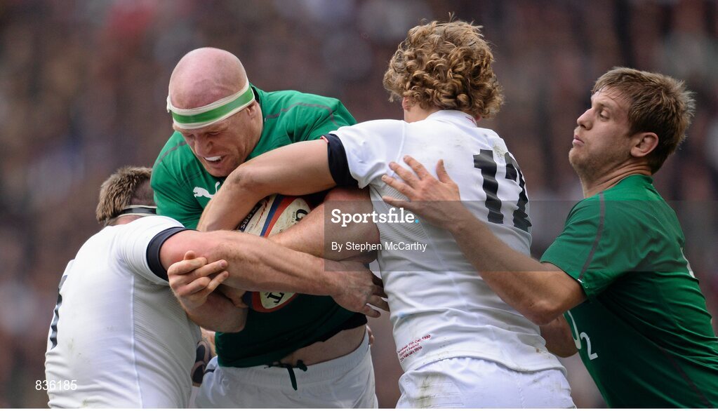 22 February 2014; Paul O'Connell with support from his  Ireland team-mate Chris Henry, right, is tackled by Joe Merler, left, and Billy Twelvetrees, England. RBS Six Nations Rugby Championship, England v Ireland, Twickenham Stadium, Twickenham, London, England. Picture credit: Stephen McCarthy / SPORTSFILE