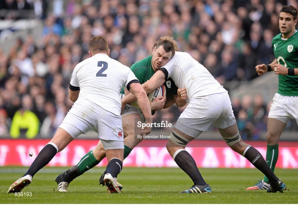 22 February 2014; Cian Healy, Ireland, is tackled by Joe Launchbury, left, and Dylan Hartley, England. RBS Six Nations Rugby Championship, England v Ireland, Twickenham Stadium, Twickenham, London, England. Picture credit: Brendan Moran / SPORTSFILE