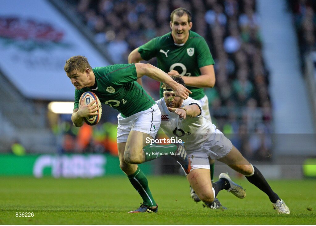22 February 2014; Brian O'Driscoll, Ireland, gets away from Tom Wood, England. RBS Six Nations Rugby Championship, England v Ireland, Twickenham Stadium, Twickenham, London, England. Picture credit: Brendan Moran / SPORTSFILE