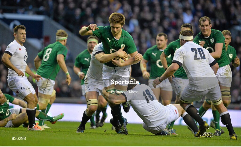 22 February 2014; Iain Henderson, Ireland, is tackled by Joe Launchbury, left, and Henry Thomas, England. RBS Six Nations Rugby Championship, England v Ireland. Twickenham Stadium, Twickenham, London, England. Picture credit: Brendan Moran / SPORTSFILE
