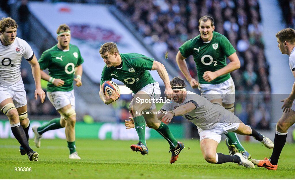 22 February 2014; Brian O'Driscoll, Ireland, breaks away from the tackle of Tom Wood, England. RBS Six Nations Rugby Championship, England v Ireland. Twickenham Stadium, Twickenham, London, England. Picture credit: Brendan Moran / SPORTSFILE