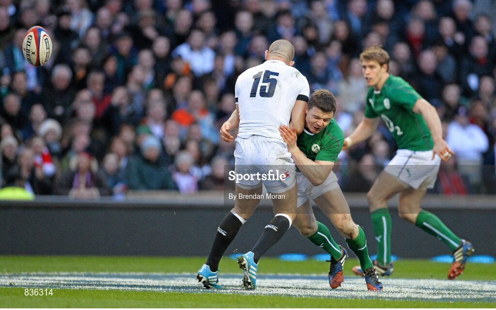 22 February 2014; Brian O'Driscoll, Ireland, puts in a tackle on Mike Brown, England. RBS Six Nations Rugby Championship, England v Ireland. Twickenham Stadium, Twickenham, London, England. Picture credit: Brendan Moran / SPORTSFILE