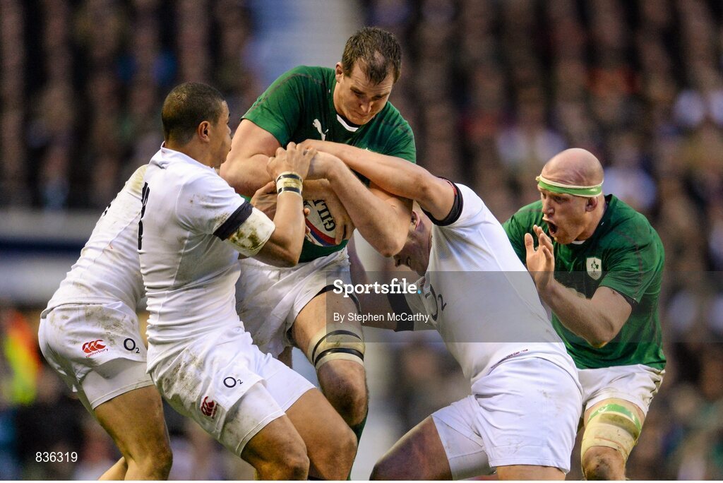 22 February 2014; Devin Toner with support from his Ireland team-mate Paul O'Connell, right, is tackled by England players, from left, Jonny May, Luther Burrell and Dylan Hartley. RBS Six Nations Rugby Championship, England v Ireland, Twickenham Stadium, Twickenham, London, England. Picture credit: Stephen McCarthy / SPORTSFILE