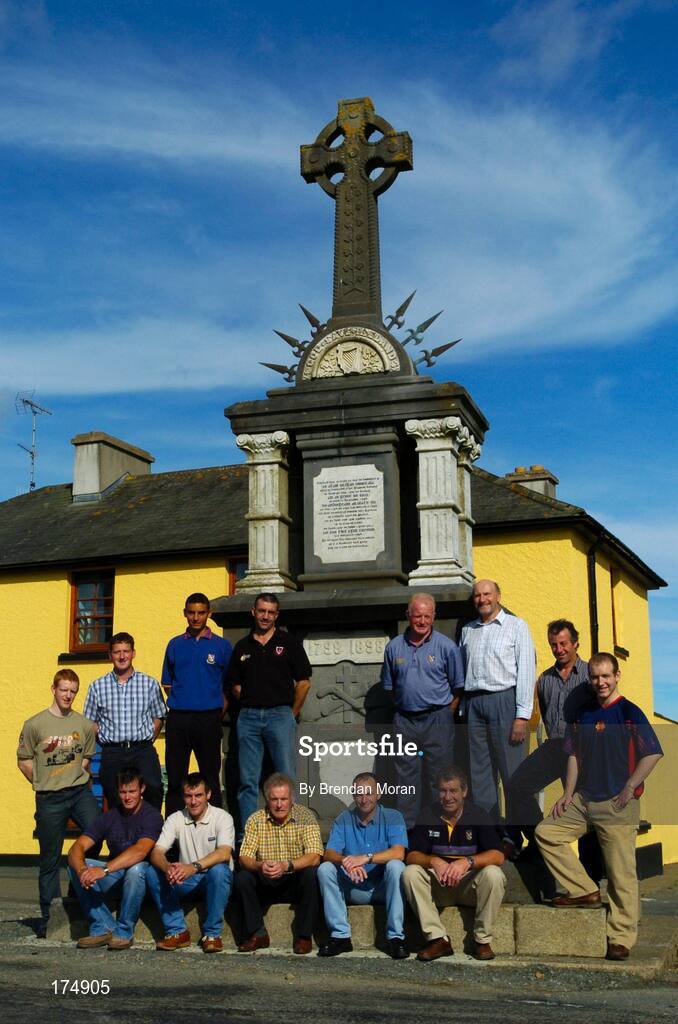 6 August 2004; Oulart-the-Ballagh men who won All-Ireland titles for Wexford pictured in front of the 1798 Rebellion Monument. Back row, from left, Rory Jacob, Paul Finn, Keith Rossiter, Martin Storey, Mick Jacob, Tom Byrne, Tomas Dunne and Michael Jacob. Front, from left, Darren Stamp, Liam Dunne, Christy Jacob, Sean Dunne and Jimmy Prendergast. Oulart-the-Ballagh, Co. Wexford. Picture credit; Brendan Moran / SPORTSFILE