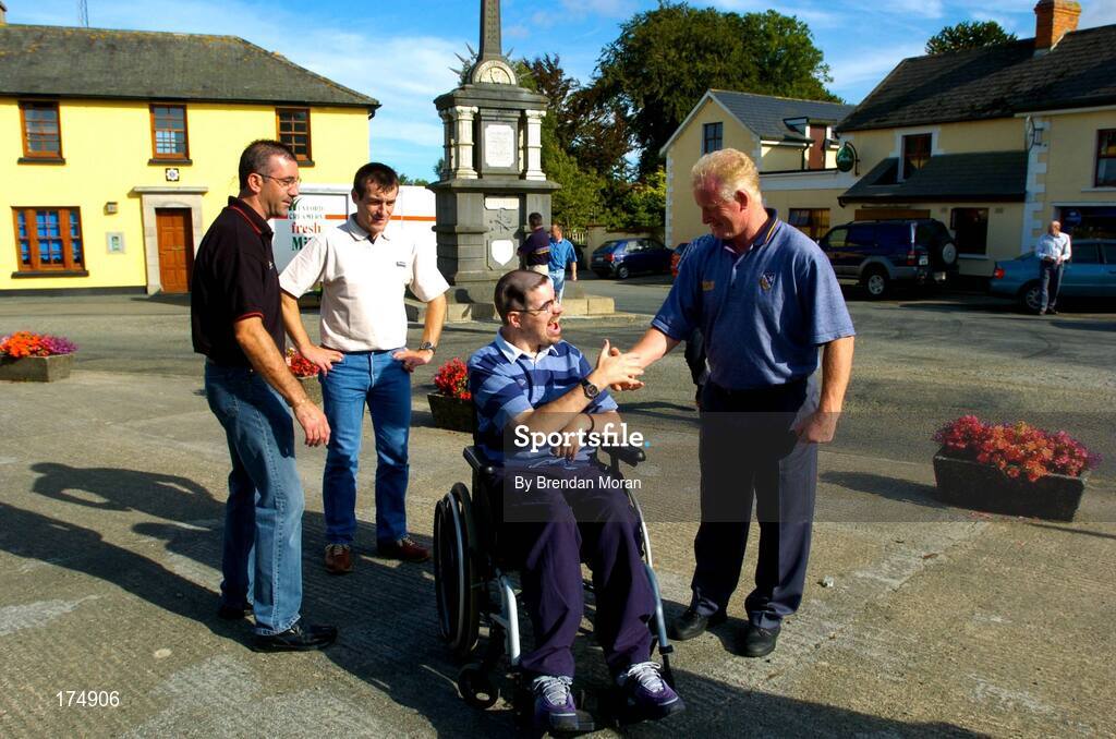 6 August 2004; Supporter Stephen Hayden, centre, meets Mick Jacob, right, watched by Martin Storey and Liam Dunne. Oulart-the-Ballagh, Co. Wexford. Picture credit; Brendan Moran / SPORTSFILE