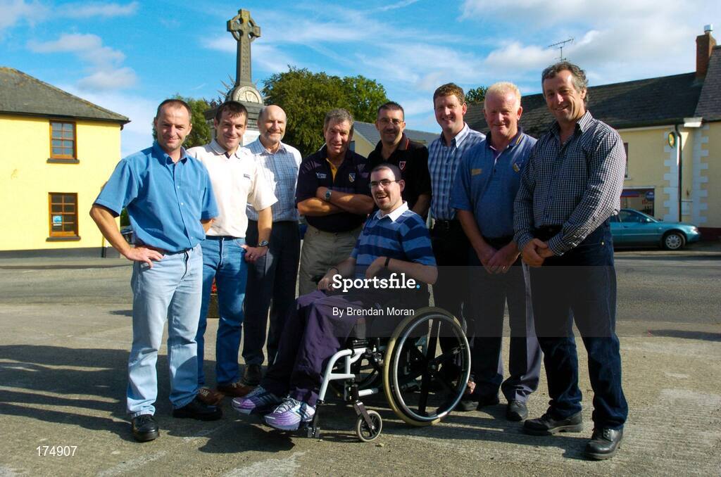 6 August 2004; Supporter Stephen Hayden, centre, surrounded by Outart-the-Ballagh and Wexford All-Ireland medallists, from left, Sean Dunne, Liam Dunne, Tom Byrne, Jimmy Prendergast, Martin Storey, Paul Finn, Mick Jacob and Tomas Dunne. Oulart-the-Ballagh, Co. Wexford. Picture credit; Brendan Moran / SPORTSFILE