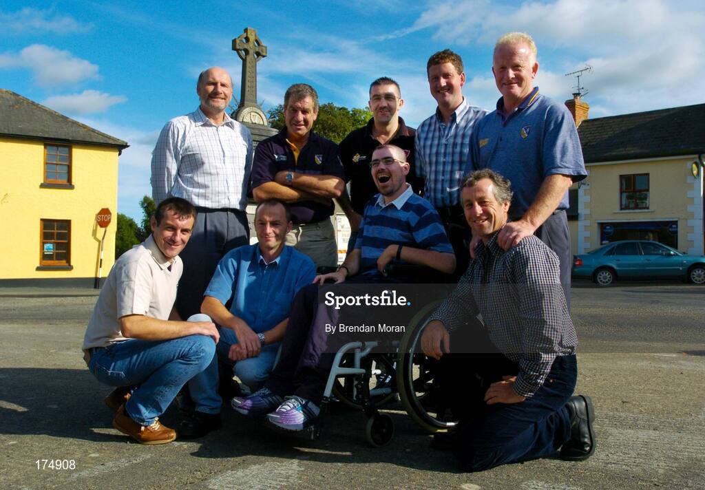 6 August 2004; Supporter Stephen Hayden, centre, surrounded by Outart-the-Ballagh and Wexford All-Ireland medal winners. Front, from left, Sean Dunne, Liam Dunne and Tomas Dunne. Back, from left, Tom Byrne, Jimmy Prendergast, Martin Storey, Paul Finn and Mick Jacob. Oulart-the-Ballagh, Co. Wexford. Picture credit; Brendan Moran / SPORTSFILE