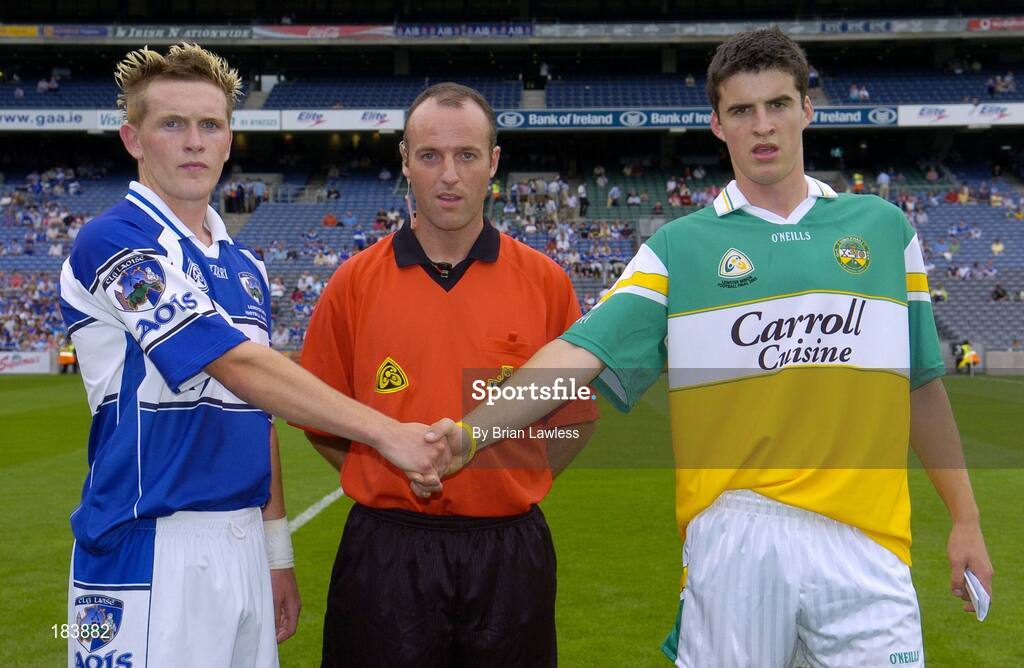 17 July 2005; Laois captain Richard Ryan shakes hands with Offaly captain Richard Dalton in the company of referee Cormac Reilly. Leinster Minor Football Championship Final, Offaly v Laois, Croke Park, Dublin. Picture credit; Brian Lawless / SPORTSFILE