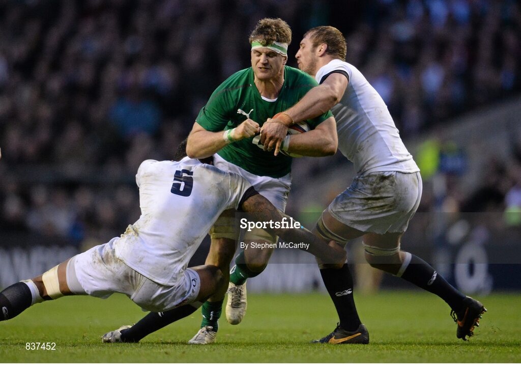 22 February 2014; Jamie Heaslip, Ireland, is tackled by Courtney Lawes, left, and Chris Robshaw, right, England. RBS Six Nations Rugby Championship, England v Ireland, Twickenham Stadium, Twickenham, London, England. Picture credit: Stephen McCarthy / SPORTSFILE