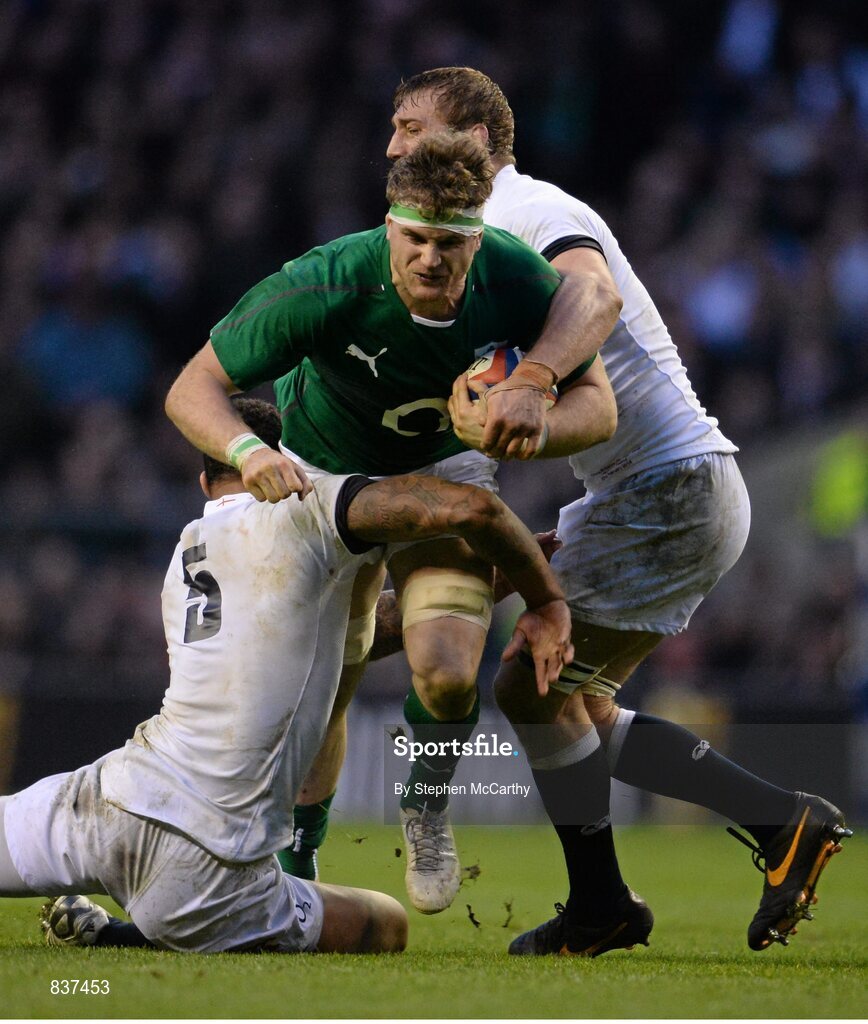 22 February 2014; Jamie Heaslip, Ireland, is tackled by Courtney Lawes, left, and Chris Robshaw, right, England. RBS Six Nations Rugby Championship, England v Ireland, Twickenham Stadium, Twickenham, London, England. Picture credit: Stephen McCarthy / SPORTSFILE