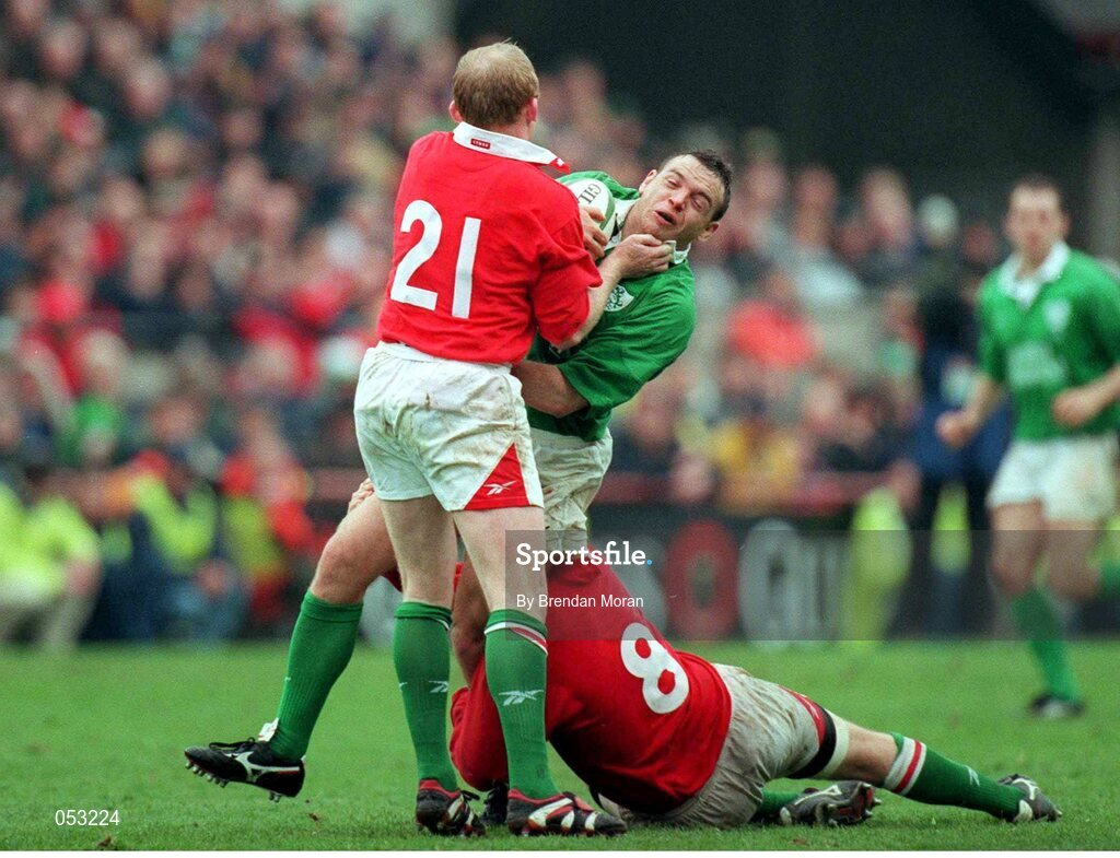 1 April 2000; Rob Henderson, Ireland, is tackled by Neil Jenkins, 21, and Geraint Lewis, Wales. Six Nations Rugby International, Ireland v Wales, Lansdowne Road, Dublin. Picture credit: Brendan Moran / SPORTSFILE
