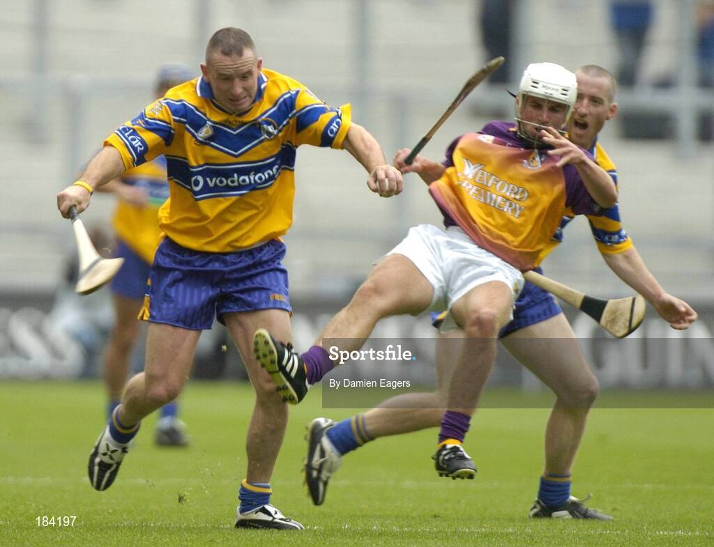24 July 2005;  Clare's Colin Lynch supported by teammate David Hoey, in action against Redmond Barry, Wexford. Guinness All-Ireland Senior Hurling Championship Quarter-Final, Wexford v Clare, Croke Park, Dublin. Picture credit; Damien Eagers / SPORTSFILE