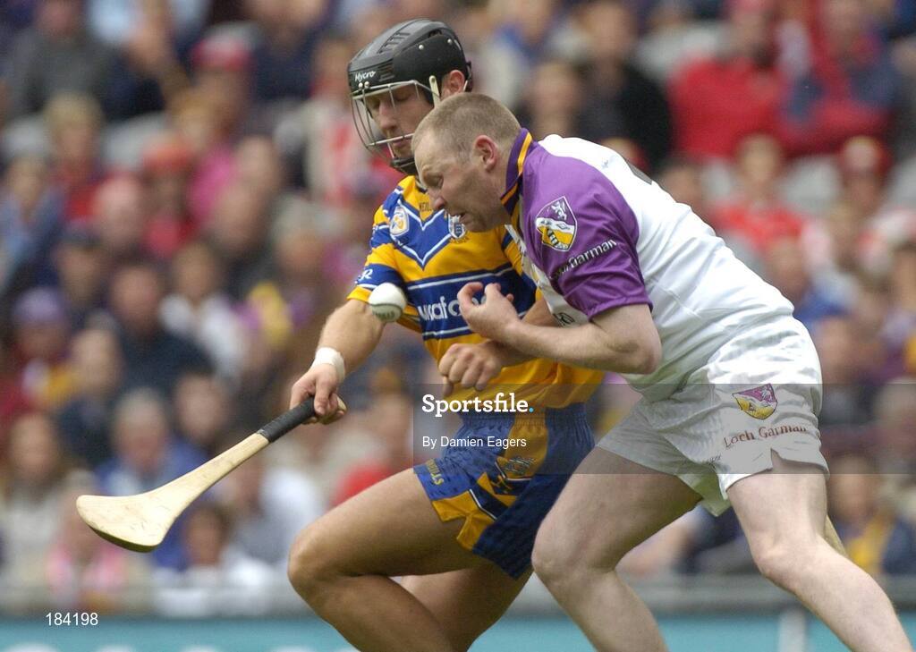 24 July 2005; Damien Fitzhenry, Wexford goalkeeper, is tackled by Tony Carmody, Clare. Guinness All-Ireland Senior Hurling Championship Quarter-Final, Wexford v Clare, Croke Park, Dublin. Picture credit; Damien Eagers / SPORTSFILE