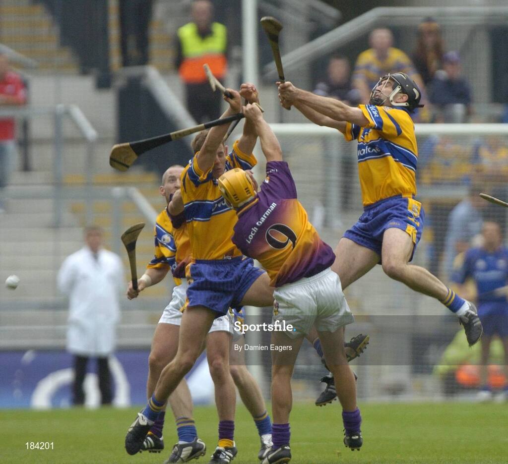 24 July 2005; Sean McMahon, and Brian O'Connell, (no helmet), Clare, in action against Rory McCarthy, Wexford. Guinness All-Ireland Senior Hurling Championship Quarter-Final, Wexford v Clare, Croke Park, Dublin. Picture credit; Damien Eagers / SPORTSFILE