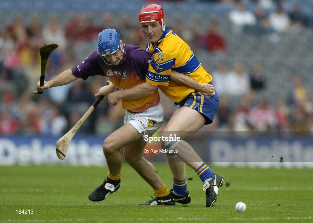 24 July 2005; Michael Jordan, Wexford, is tackled by Brian Lohan, Clare. Guinness All-Ireland Senior Hurling Championship Quarter-Final, Wexford v Clare, Croke Park, Dublin. Picture credit; Ray McManus / SPORTSFILE