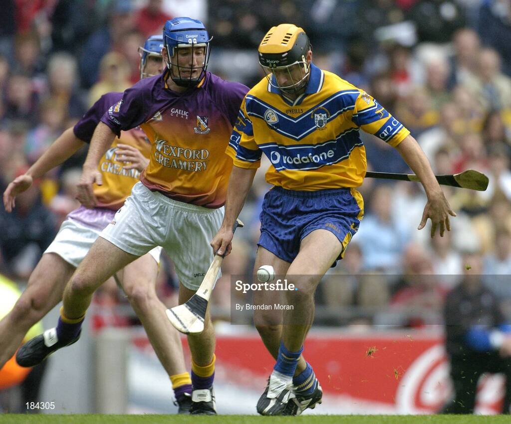 24 July 2005; Tony Griffin, Clare, is tackled by Diarmuid Lyng, Wexford. Guinness All-Ireland Senior Hurling Championship Quarter-Final, Wexford v Clare, Croke Park, Dublin. Picture credit; Brendan Moran / SPORTSFILE
