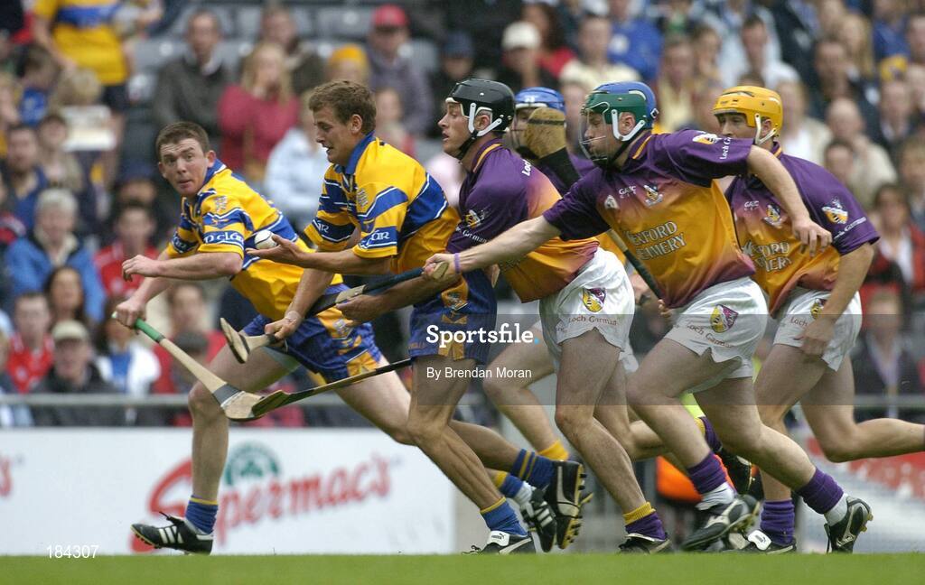 24 July 2005; Brian O'Connell, Clare, supported by team-mate Diarmuid McMahon, in action against Declan Ruth, Paul Carley and Rory McCarthy, Wexford. Guinness All-Ireland Senior Hurling Championship Quarter-Final, Wexford v Clare, Croke Park, Dublin. Picture credit; Brendan Moran / SPORTSFILE