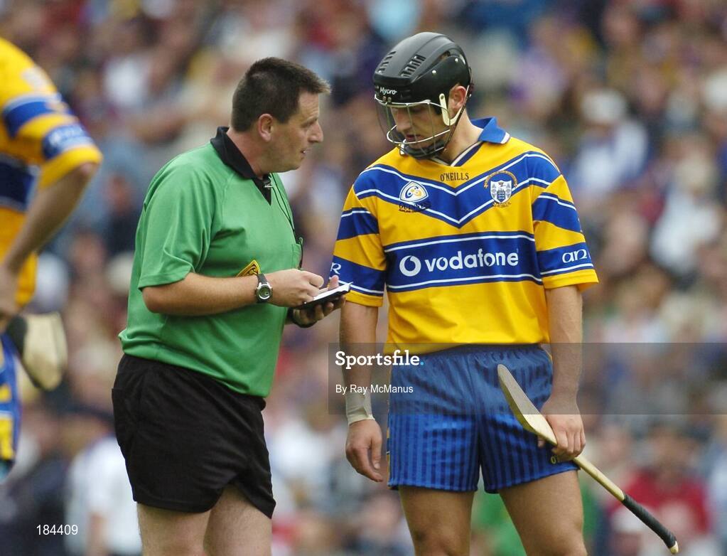 24 July 2005; Referee Brian Gavin takes Tony Carmody's, Clare, name during the match. Guinness All-Ireland Senior Hurling Championship Quarter-Final, Wexford v Clare, Croke Park, Dublin. Picture credit; Ray McManus / SPORTSFILE