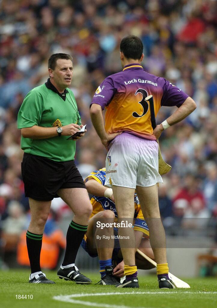 24 July 2005; Referee Brian Gavin talks to Wexford's Darragh Ryan and Clare's Tony Carmody during the match. Guinness All-Ireland Senior Hurling Championship Quarter-Final, Wexford v Clare, Croke Park, Dublin. Picture credit; Ray McManus / SPORTSFILE