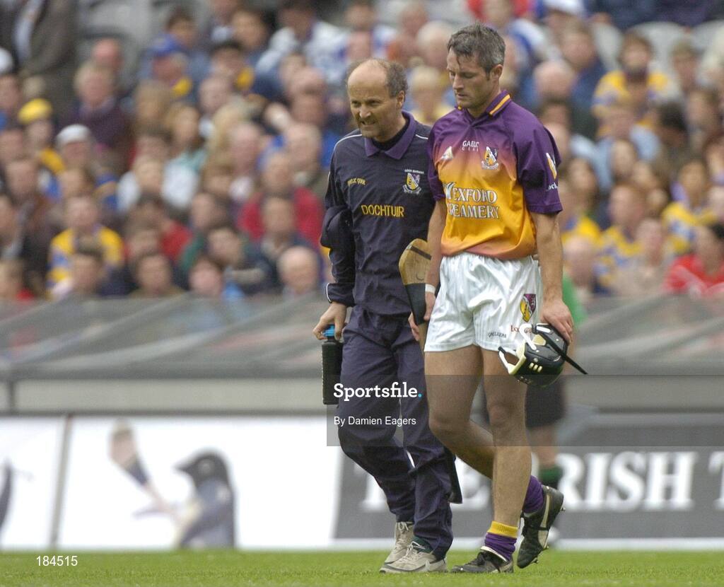 24 July 2005; Declan Ruth, Wexford walks off the field injured with team doctor Stephen Bowe. Guinness All-Ireland Senior Hurling Championship Quarter-Final, Wexford v Clare, Croke Park, Dublin. Picture credit; Damien Eagers / SPORTSFILE