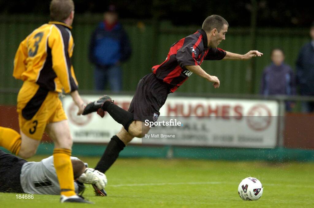 28 July 2005; Andy Myler, Longford Town, is triped by Carmarthen Town goal keeper Tony Pennock to concede a penalty. UEFA Cup, First Qualifying Round, 2nd Leg, Carmarthen Town v Longford Town, Latham Park, Newtown, Wales. Picture credit; Matt Browne / SPORTSFILE