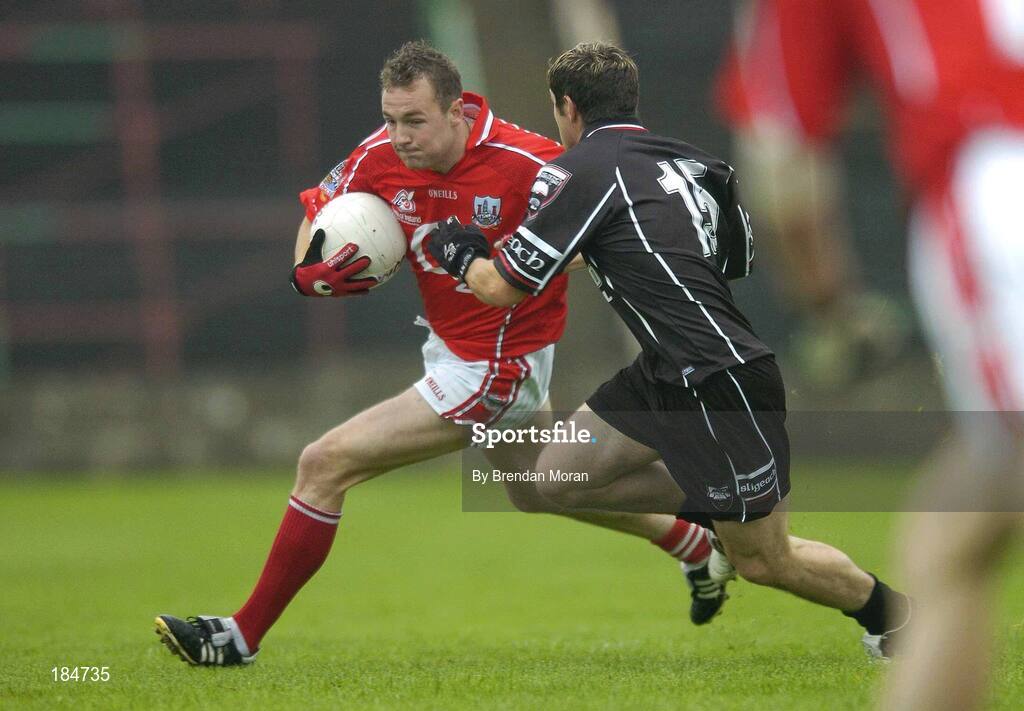 30 July 2005; James Masters, Cork, is tackled by Brian Curran, Sligo. Bank of Ireland Football Championship qualifiers, Round 4. Cork v Sligo, O'Moore Park, Portlaoise, Co. Laois. Picture credit; Brendan Moran / SPORTSFILE