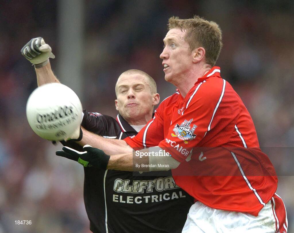 30 July 2005; Conor McCarthy, Cork, is tackled by Jonathon Davey, Sligo. Bank of Ireland Football Championship qualifiers, Round 4. Cork v Sligo, O'Moore Park, Portlaoise, Co. Laois. Picture credit; Brendan Moran / SPORTSFILE