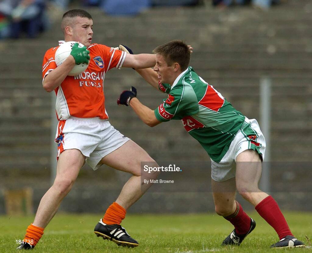 30 July 2005; Kevin O'Rourke, Armagh, is tackled by Dara Conway, Mayo. All-Ireland Minor Football Quarter-Final, Mayo v Armagh, Dr. Hyde Park, Roscommon. Picture credit; Matt Browne / SPORTSFILE
