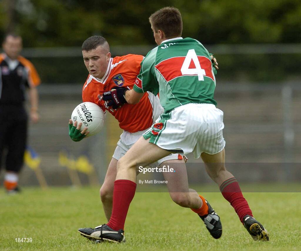 30 July 2005; Kevin O'Rourke, Armagh, is tackled by Dara Conway, Mayo. All-Ireland Minor Football Quarter-Final, Mayo v Armagh, Dr. Hyde Park, Roscommon. Picture credit; Matt Browne / SPORTSFILE