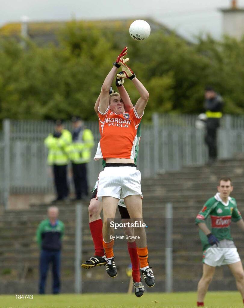 30 July 2005; David McKenna, Armagh, contests a high ball with Peter Collins, Mayo. All-Ireland Minor Football Quarter-Final, Mayo v Armagh, Dr. Hyde Park, Roscommon. Picture credit; Matt Browne / SPORTSFILE