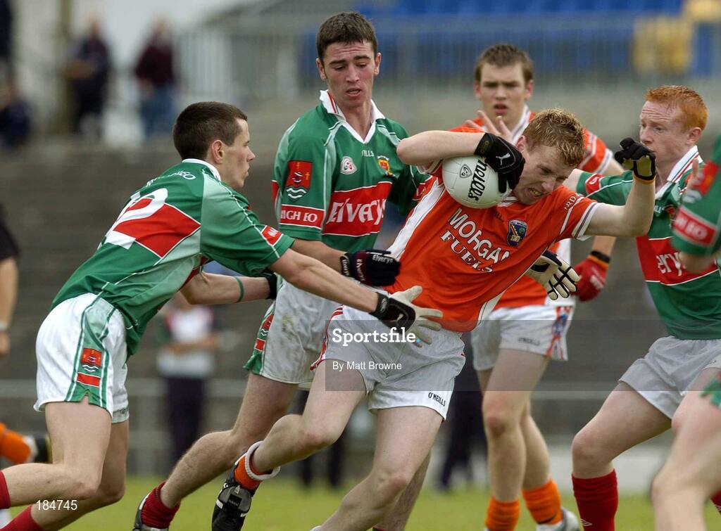 30 July 2005; Padraig McCourt, Armagh, is tackled by Paric O'Connor, left, Dermot O'Connor, and Ronan O'Boyle,right, Mayo. All-Ireland Minor Football Quarter-Final, Mayo v Armagh, Dr. Hyde Park, Roscommon. Picture credit; Matt Browne / SPORTSFILE