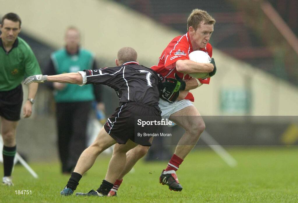30 July 2005; Conor McCarthy, Cork, is tackled by Jonathon Davey, Sligo. Bank of Ireland Football Championship qualifiers, Round 4. Cork v Sligo, O'Moore Park, Portlaoise, Co. Laois. Picture credit; Brendan Moran / SPORTSFILE