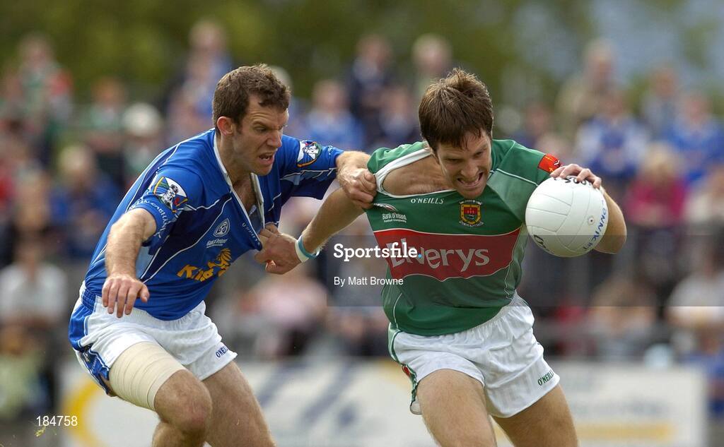 30 July 2005; Billy Joe Padden, Mayo, is tackled by Cathal Collins, Cavan. Bank of Ireland Football Championship qualifer, Round 4. Mayo v Cavan, Dr. Hyde Park, Roscommon. Picture credit; Matt Browne / SPORTSFILE