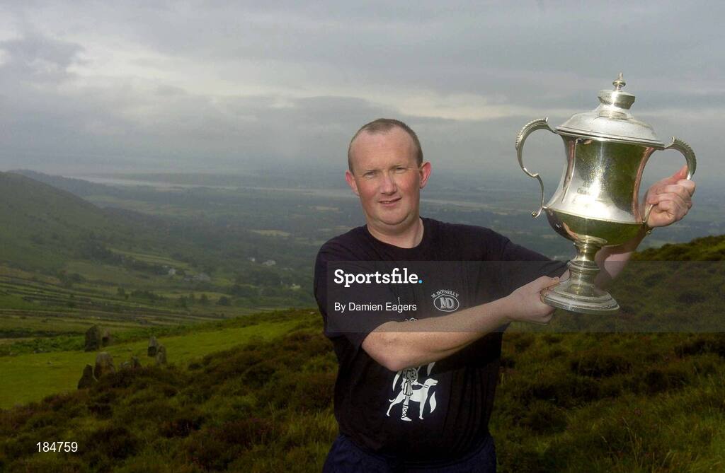 30 July 2005; Albert Shanahan representing Limerick lifts the cup after winning theM Donnelly Poc Fada na hEireann Final. Annaverna Mountain Ravensdale, Cooley Mountains, Co. Louth. Picture credit; Damien Eagers / SPORTSFILE