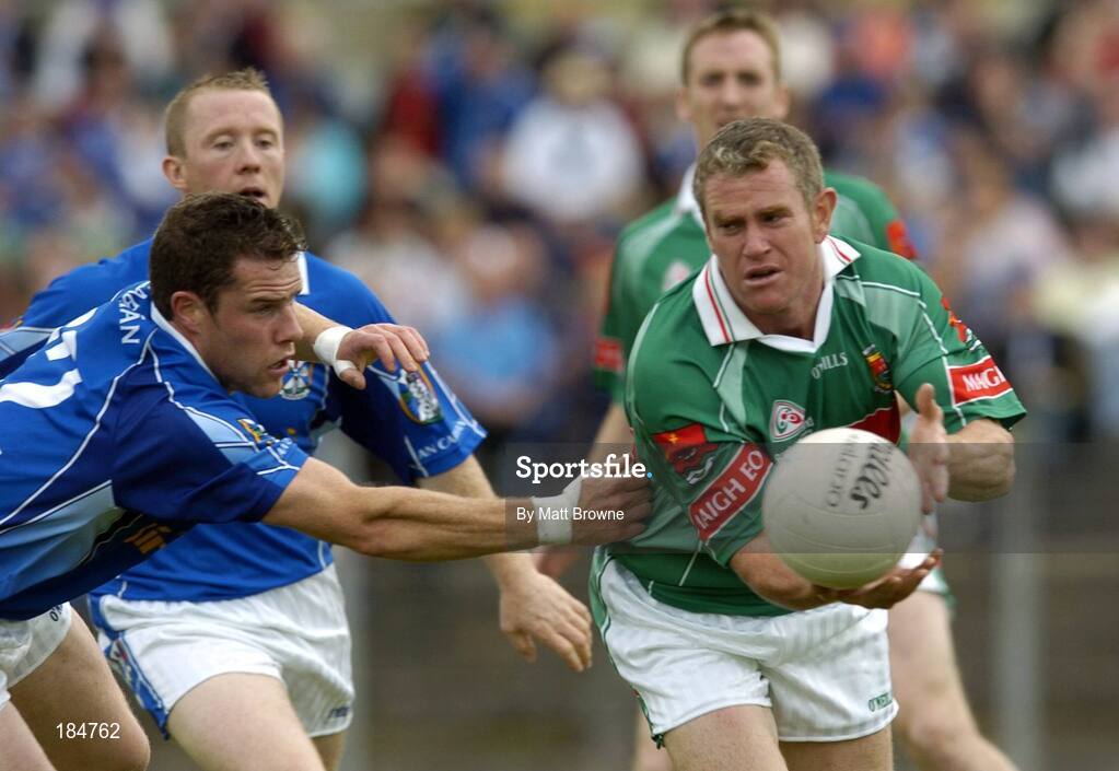 30 July 2005; Gary Ruane of Mayo is tackled by Finbar O'Reilly of Cavan during the GAA All-Ireland Football Championship Qualifer, Round 4 match between Mayo and Cavan at Dr Hyde Park in Roscommon. Photo by Matt Browne/Sportsfile