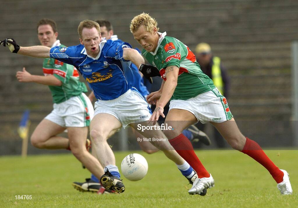 30 July 2005; Ciaran McDonnell, Mayo, is tackled by Anthony Forde, Cavan. Bank of Ireland Football Championship qualifer, Round 4. Mayo v Cavan, Dr. Hyde Park, Roscommon. Picture credit; Matt Browne / SPORTSFILE