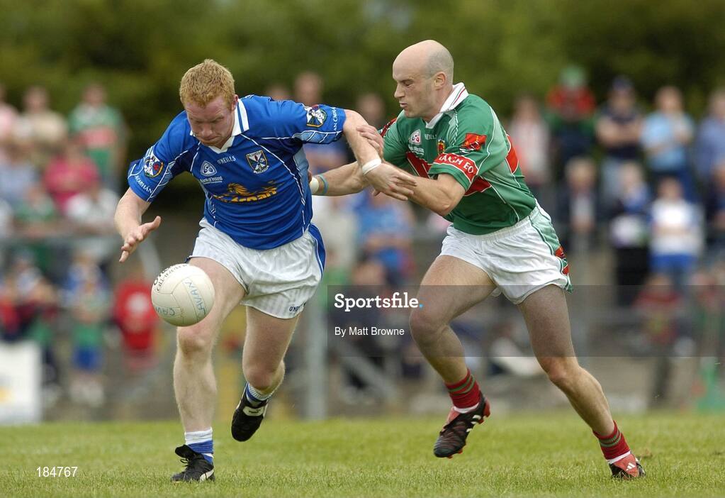 30 July 2005; Dermot McCabe, Cavan, is tackled by Shane Fitzmaurice, Mayo. Bank of Ireland Football Championship qualifer, Round 4. Mayo v Cavan, Dr. Hyde Park, Roscommon. Picture credit; Matt Browne / SPORTSFILE