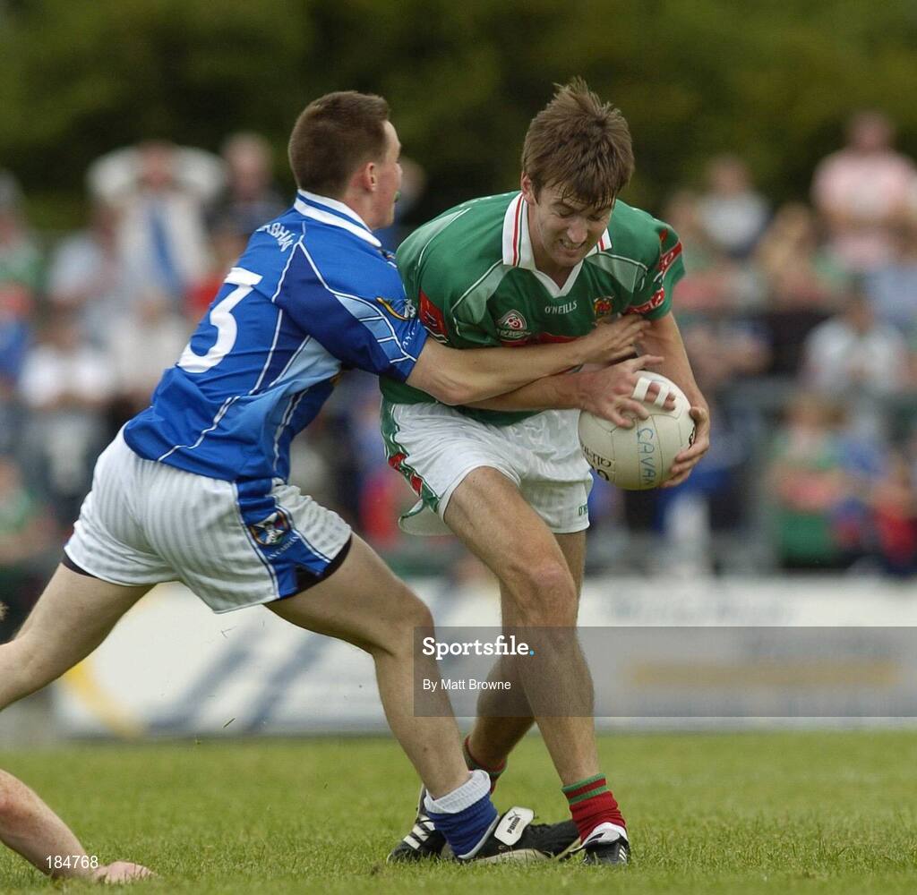 30 July 2005; Ronan McGarrity, Mayo, is tackled by Sean Johnston, Cavan. Bank of Ireland Football Championship qualifer, Round 4. Mayo v Cavan, Dr. Hyde Park, Roscommon. Picture credit; Matt Browne / SPORTSFILE