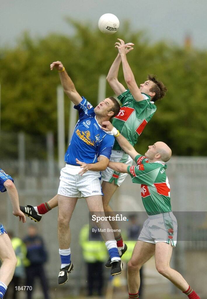 30 July 2005; Ronan McGarrity and Shane Fitzmaurice Mayo, contest a high ball with Paddy Brady, Cavan. Bank of Ireland Football Championship qualifer, Round 4. Mayo v Cavan, Dr. Hyde Park, Roscommon. Picture credit; Matt Browne / SPORTSFILE