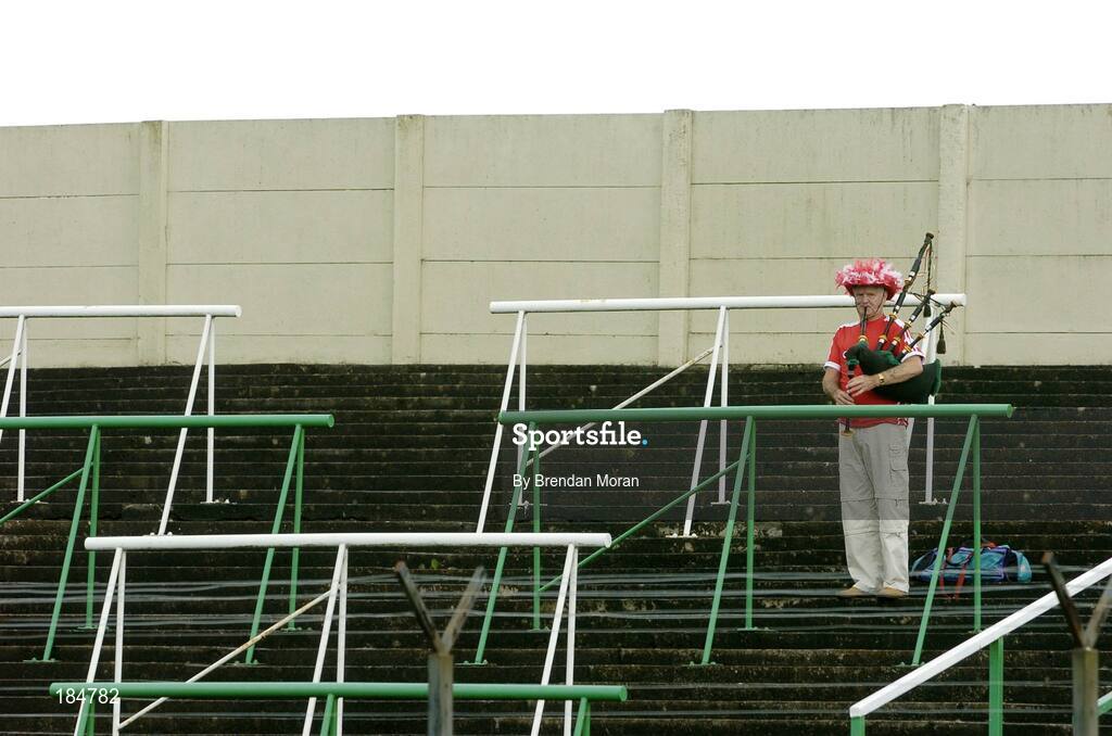 30 July 2005; Pa Hurley, from Mayfield, Cork, plays his bagpipes before the game. Bank of Ireland Football Championship qualifiers, Round 4. Cork v Sligo, O'Moore Park, Portlaoise, Co. Laois. Picture credit; Brendan Moran / SPORTSFILE