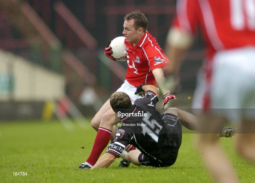 30 July 2005; James Masters, Cork, is tackled by Brian Curran, Sligo. Bank of Ireland Football Championship qualifiers, Round 4. Cork v Sligo, O'Moore Park, Portlaoise, Co. Laois. Picture credit; Brendan Moran / SPORTSFILE