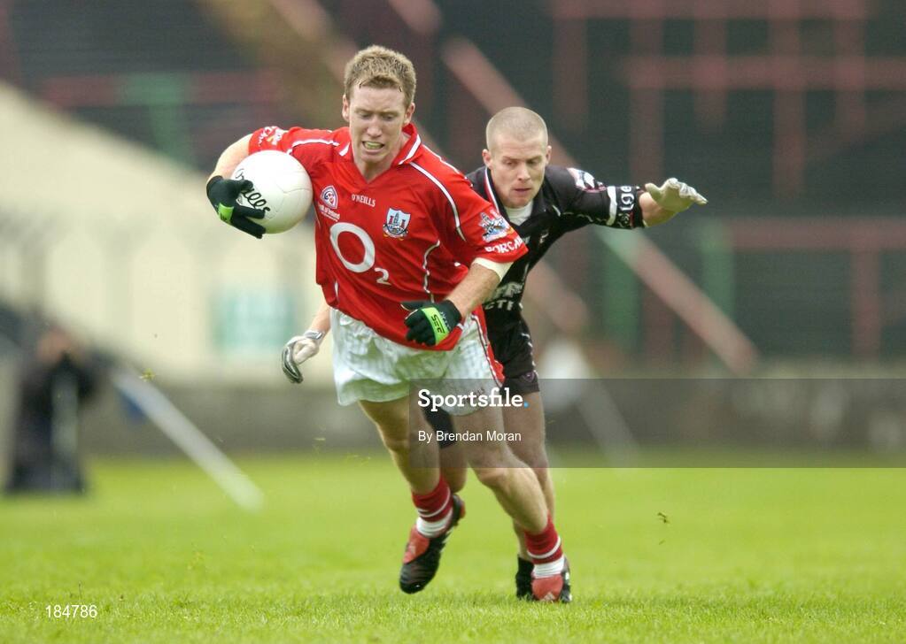 30 July 2005; Conor McCarthy, Cork, is tackled by Jonathon Davey, Sligo. Bank of Ireland Football Championship qualifiers, Round 4. Cork v Sligo, O'Moore Park, Portlaoise, Co. Laois. Picture credit; Brendan Moran / SPORTSFILE