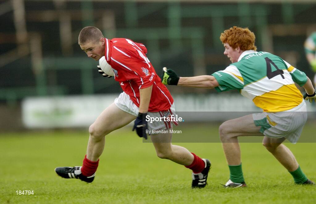 30 July 2005; Colm O'Neill, Cork is tackled by Diarmuid Horan, Offaly. All-Ireland Minor Football Championship Quarter Final, Cork v Offaly, O'Moore Park, Portlaoise, Co. Laois. Picture credit; Brendan Moran / SPORTSFILE