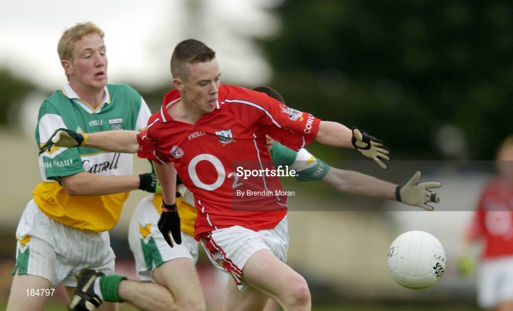 30 July 2005; Sean Kiely, Cork, is tackled by Stephen Lonergan and Gerry Grehan, Offaly. All-Ireland Minor Football Championship Quarter Final, Cork v Offaly, O'Moore Park, Portlaoise, Co. Laois. Picture credit; Brendan Moran / SPORTSFILE