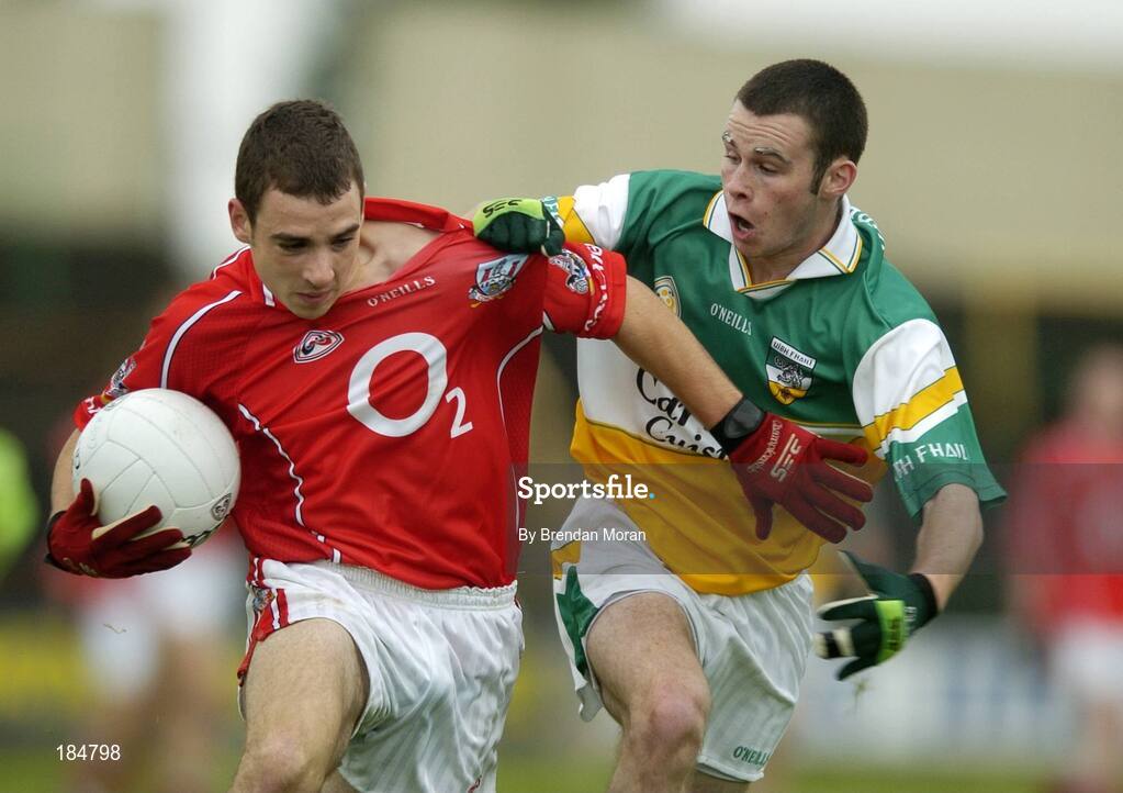 30 July 2005; Colm O'Driscoll, Cork is tackled by Gerry Grehan, Offaly. All-Ireland Minor Football Championship Quarter Final, Cork v Offaly, O'Moore Park, Portlaoise, Co. Laois. Picture credit; Brendan Moran / SPORTSFILE