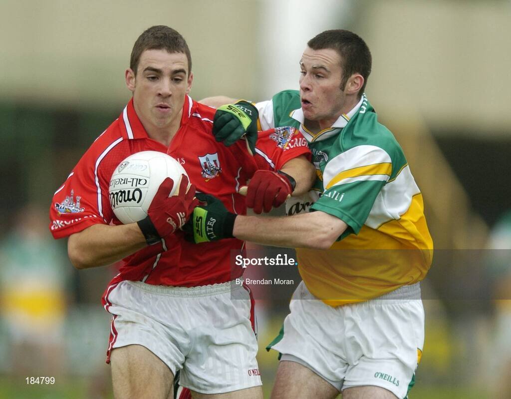 30 July 2005; Colm O'Driscoll, Cork is tackled by Gerry Grehan, Offaly. All-Ireland Minor Football Championship Quarter Final, Cork v Offaly, O'Moore Park, Portlaoise, Co. Laois. Picture credit; Brendan Moran / SPORTSFILE