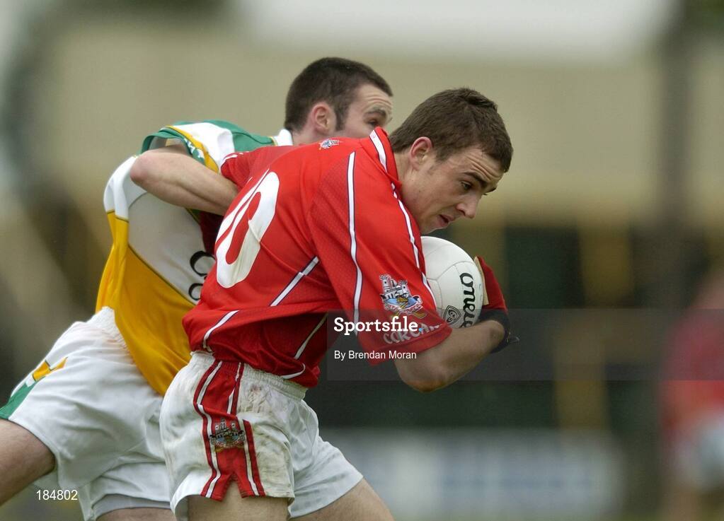 30 July 2005; Colm O'Driscoll, Cork is tackled by Gerry Grehan, Offaly. All-Ireland Minor Football Championship Quarter Final, Cork v Offaly, O'Moore Park, Portlaoise, Co. Laois. Picture credit; Brendan Moran / SPORTSFILE